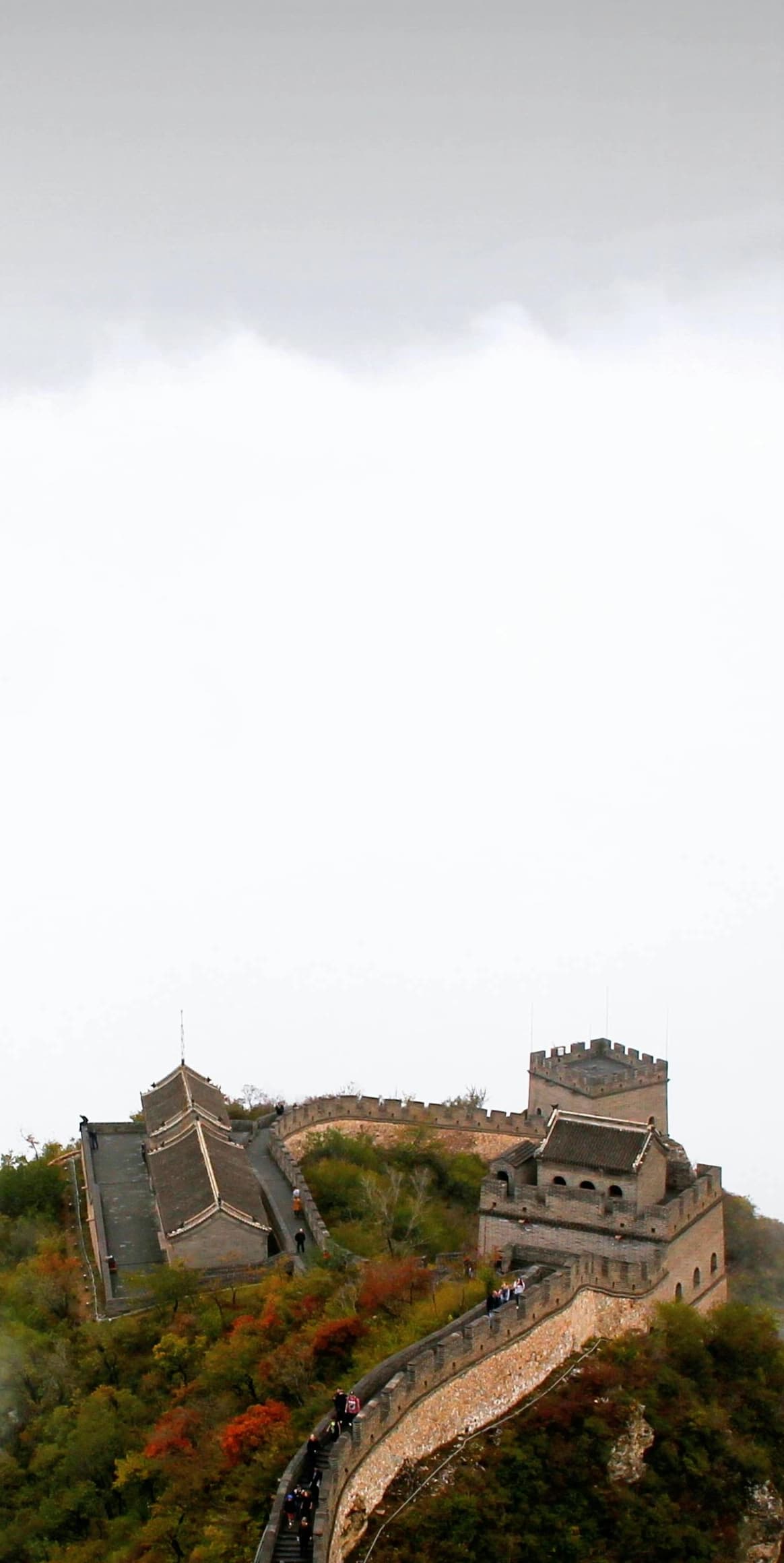 The Great Wall of China stretching across misty mountains