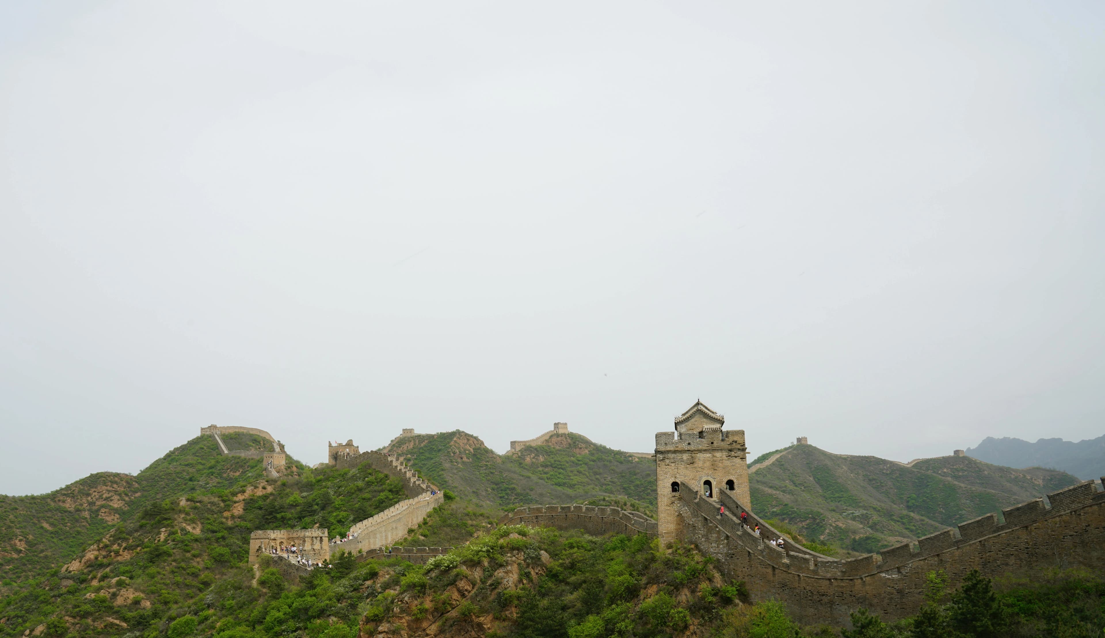 The Great Wall of China stretching across misty mountains