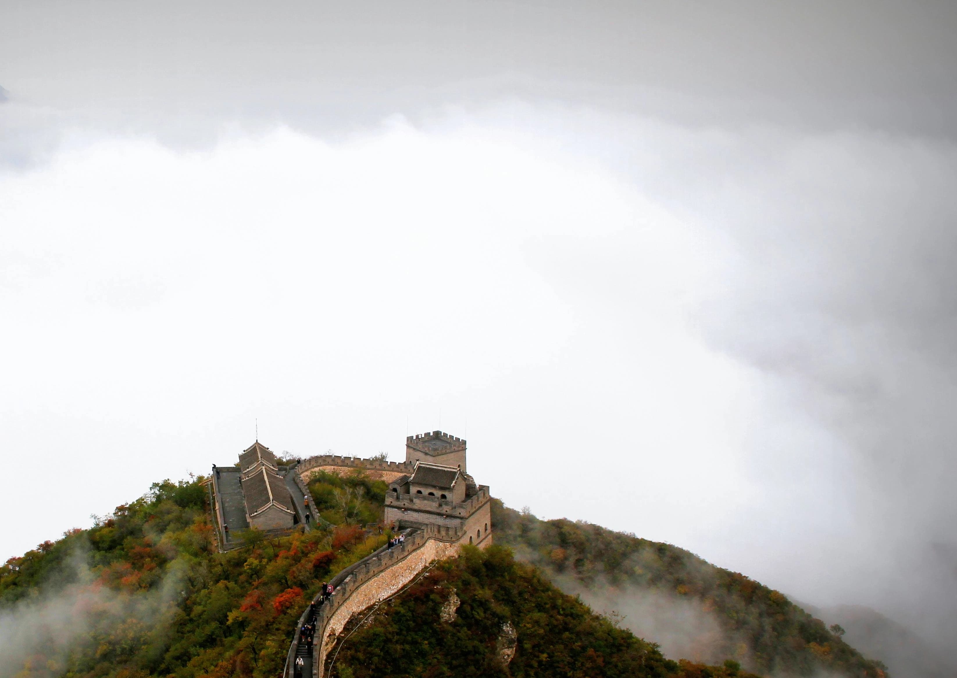 The Great Wall of China stretching across misty mountains